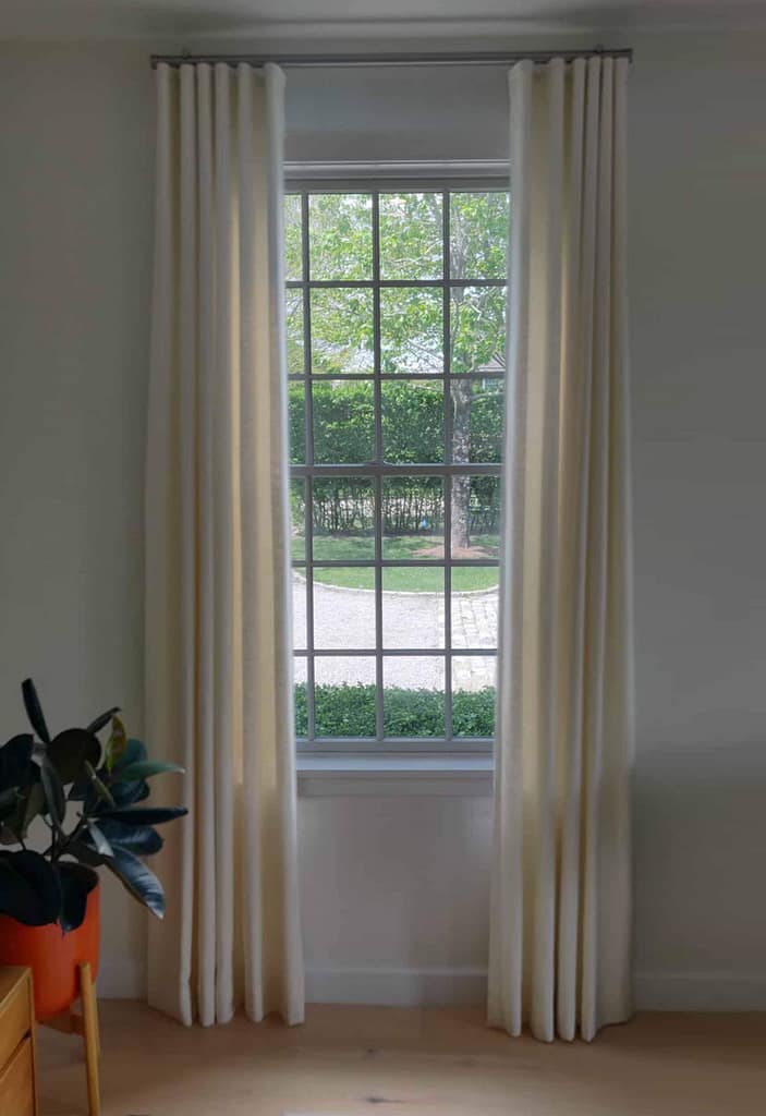 White curtains on window with garden view