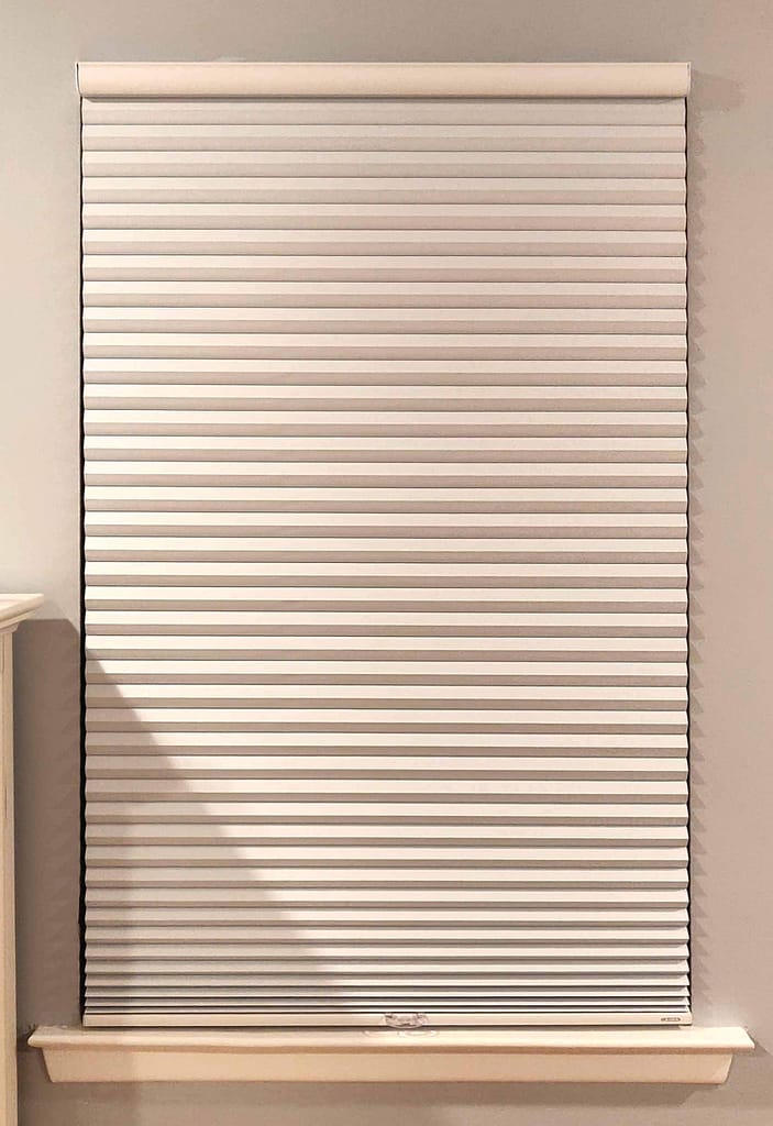 Closed white window blinds in modern room