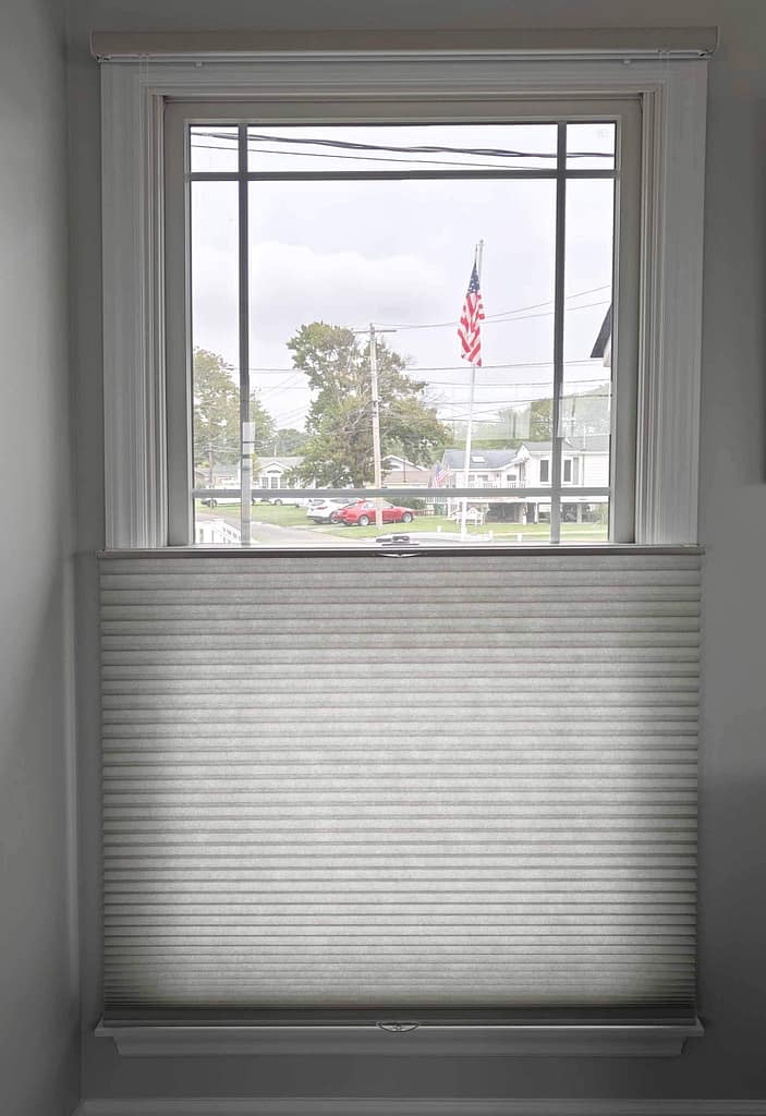 Window with partially closed cellular shades