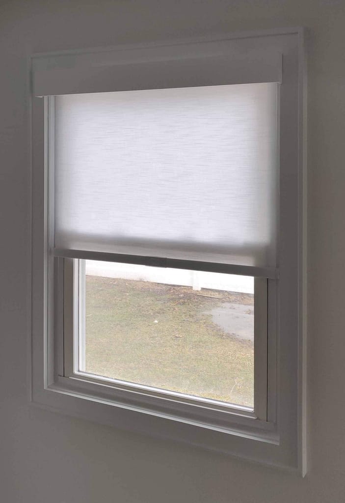 Partially closed window shade in bright room